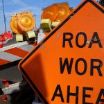 Close up of road work sign and traffic warning items