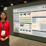 Atieh stands beside her poster on flash flood hazards