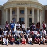 Cropped group picture of black women outside Shelby Hall