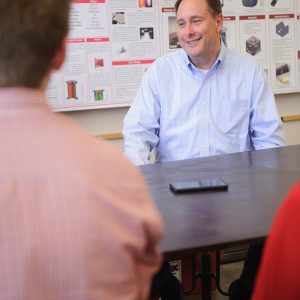 Lightfoot talks to students in a lab,