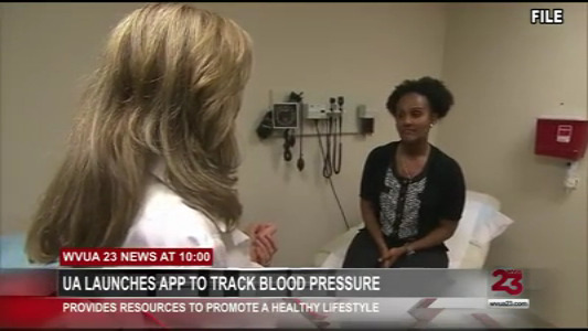 news screen capture of two people in a medical style room