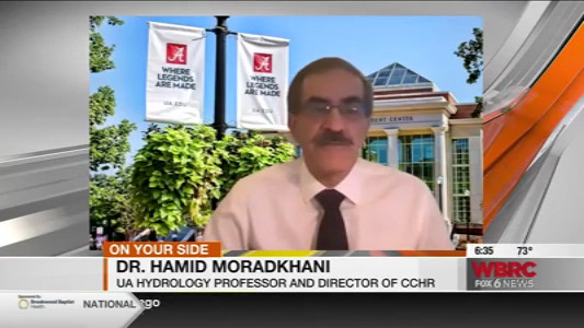 News screen capture of Dr. Moradkhani with a zoom background showing the Ferg Center