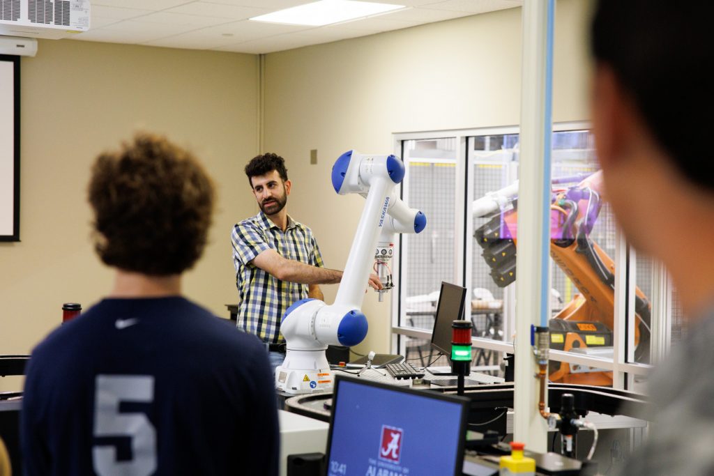 a professor demos a robot in a classroom