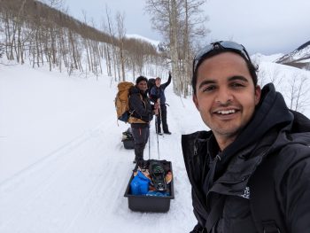 Members of the deployment team transporting their supplies to the Gothic Research Center on sleds.