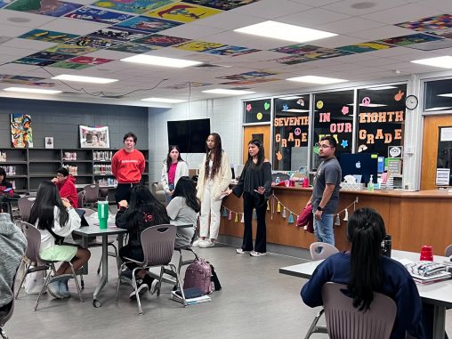 UA students talk to a classroom