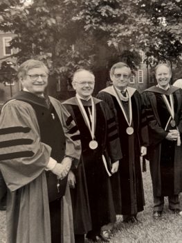4 men in doctoral robes