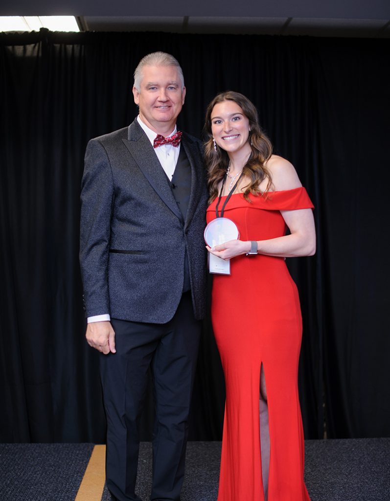 Dean and Student in red dress