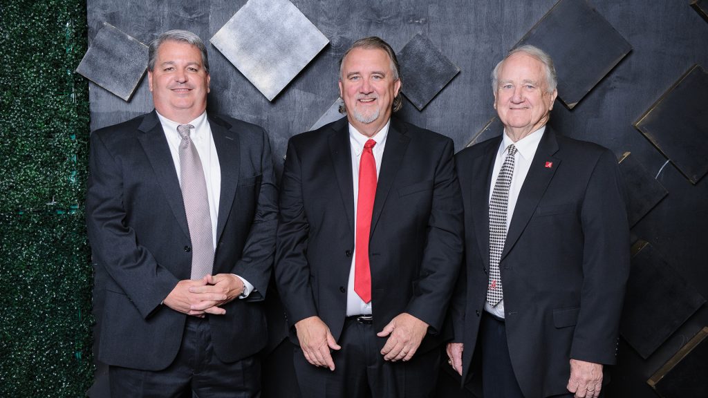 3 men in suits and ties