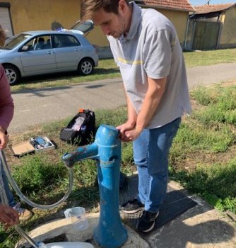 guy at a water pump