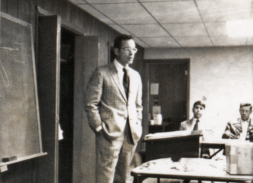 Styslinger talking in a room black and white photo