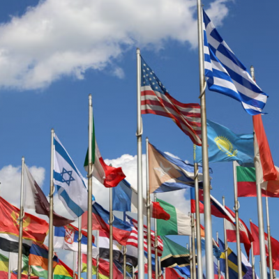 bunch of country flags waving in the air