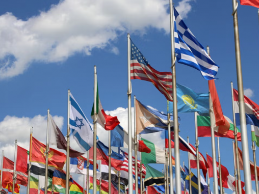 bunch of country flags waving in the air