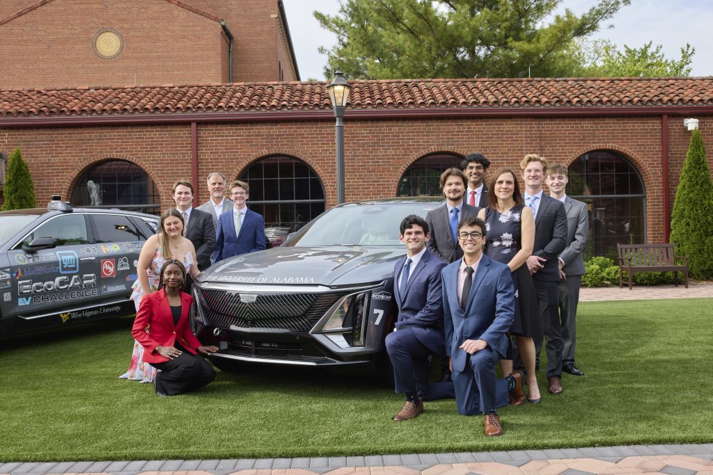 the full team of students outside with their black ecocar